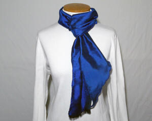 Tying at the neck this way shows both the edging and the fringing making it so unique.